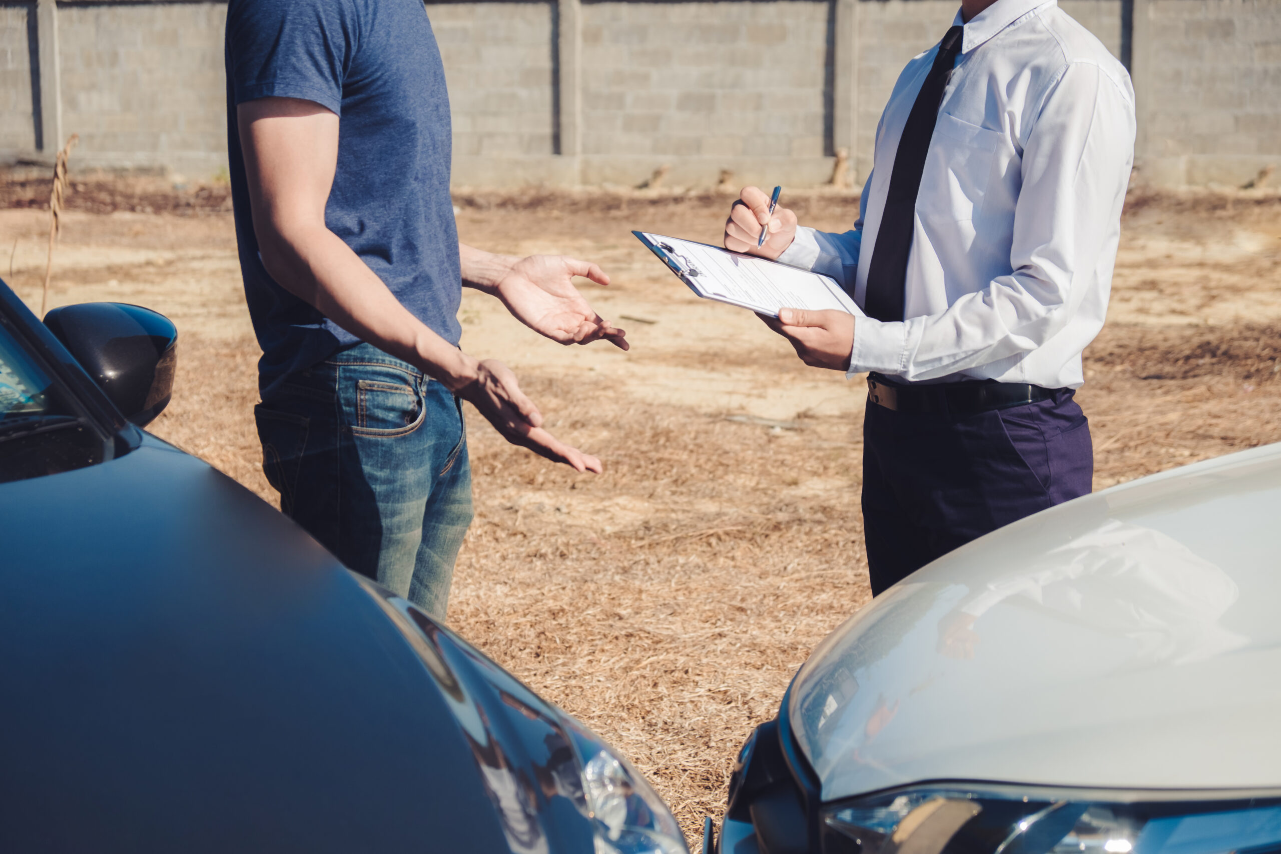 Insurance agent discussing with car owner for accident claim and processed, Car insurance concept.