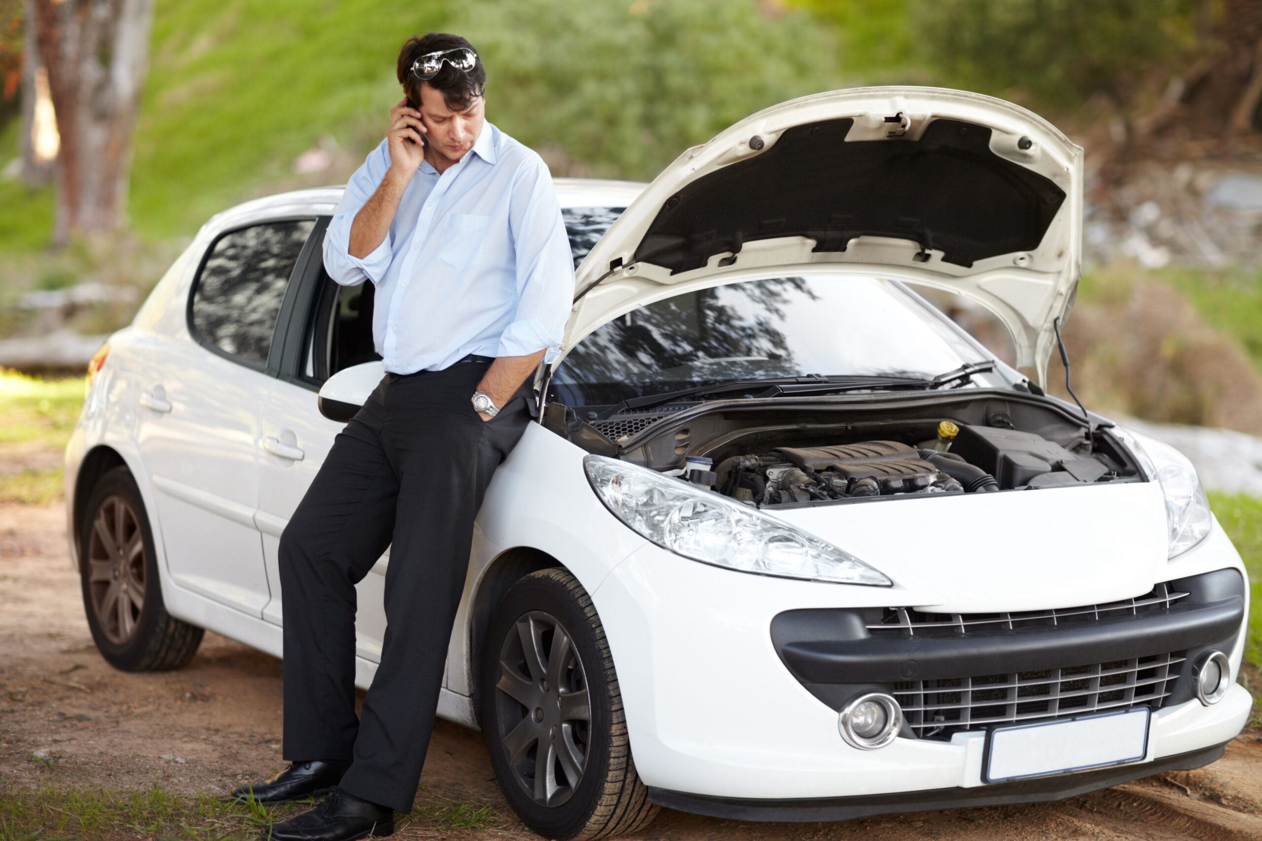 Car, phone call for help and business man talk, service and travel outdoor. Smartphone, roadside assistance and serious person with engine fail or breakdown, transport insurance or emergency support.