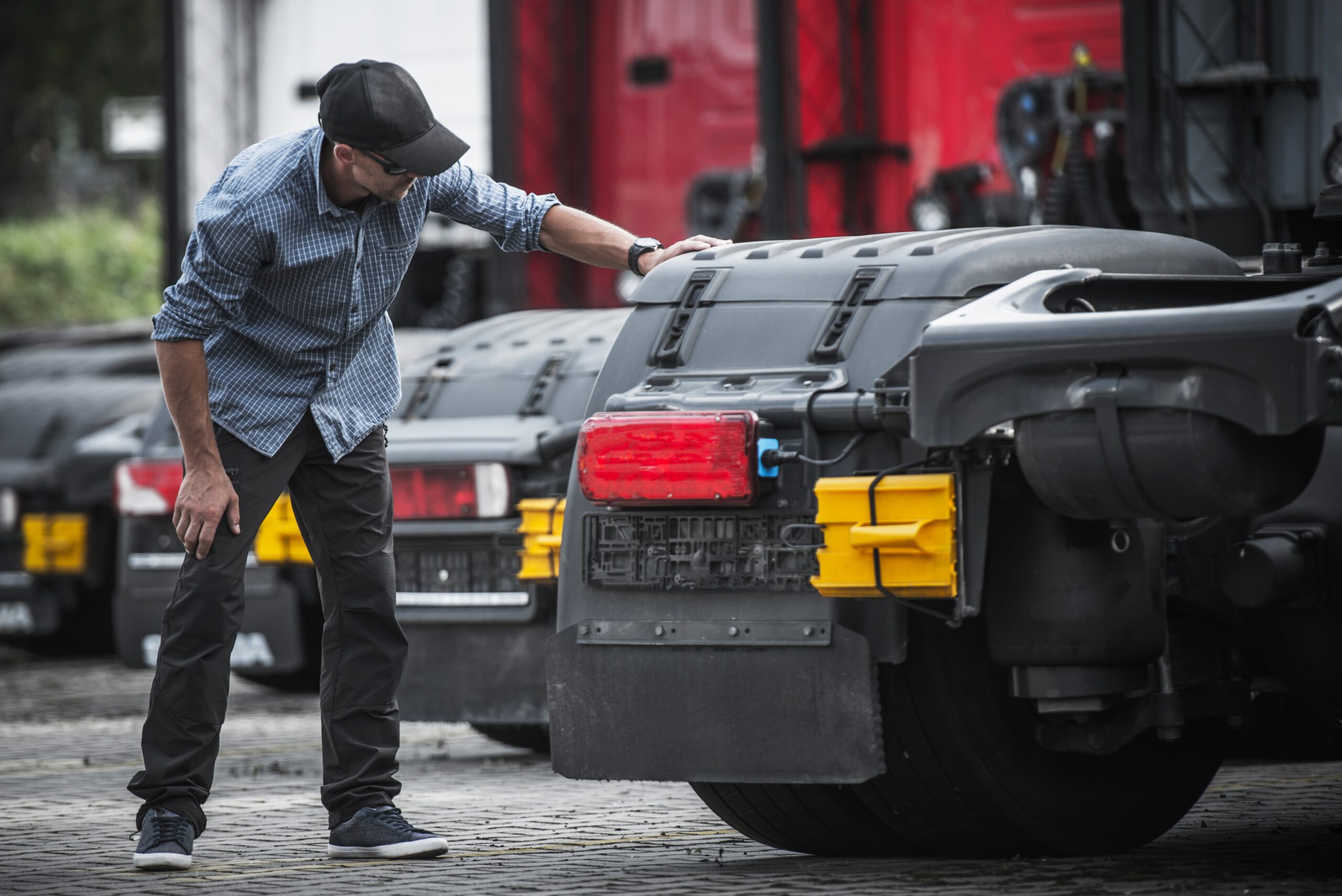 Potential Semi Truck Buyer. Caucasian Trucker Looking For a New Vehicle For His Cargo Transportation Business.